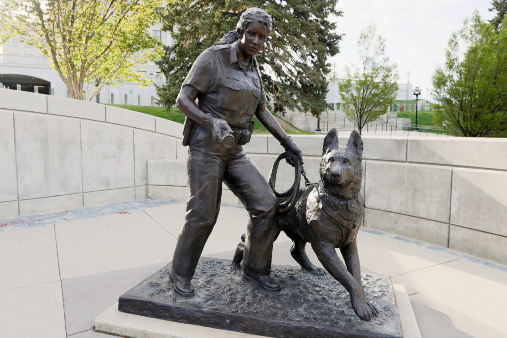 Utah Law Enforcement Memorial bronze statue of police office with police K9