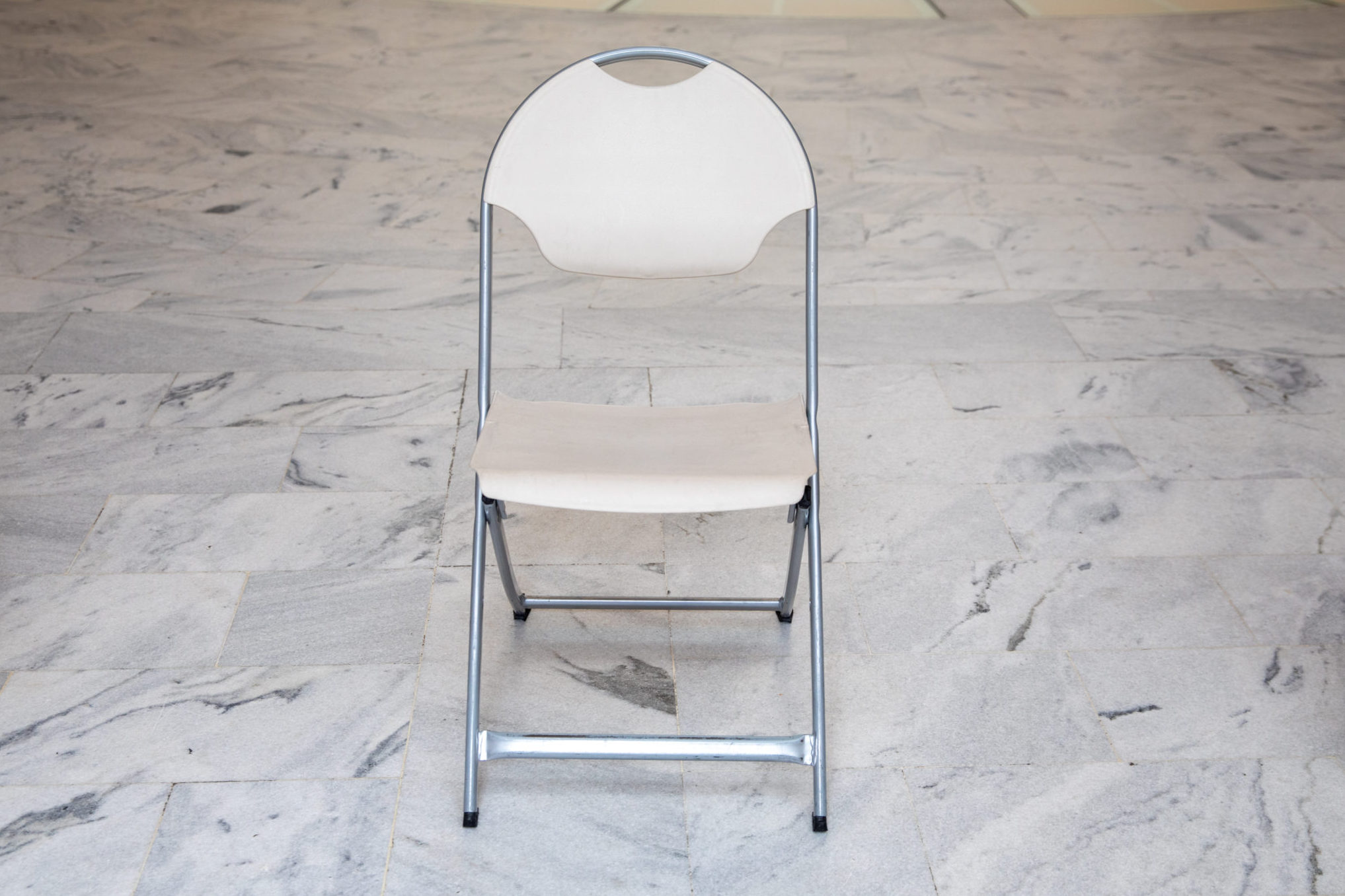 Plastic white folding chair