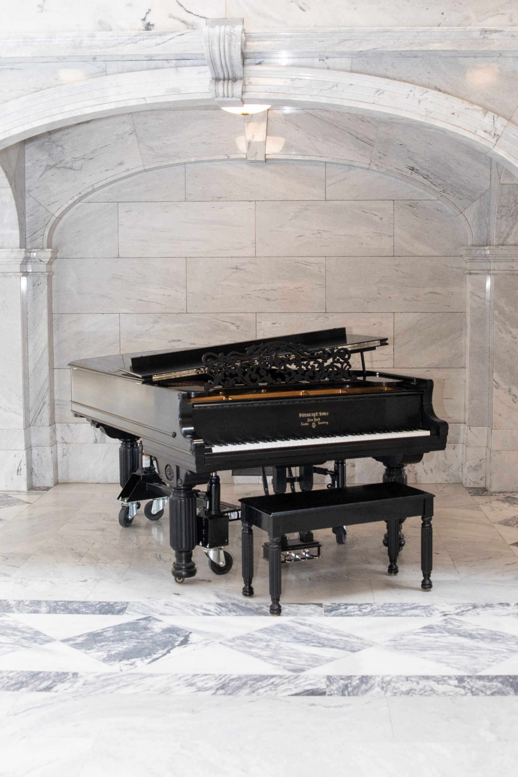 Grand piano in marble alcove
