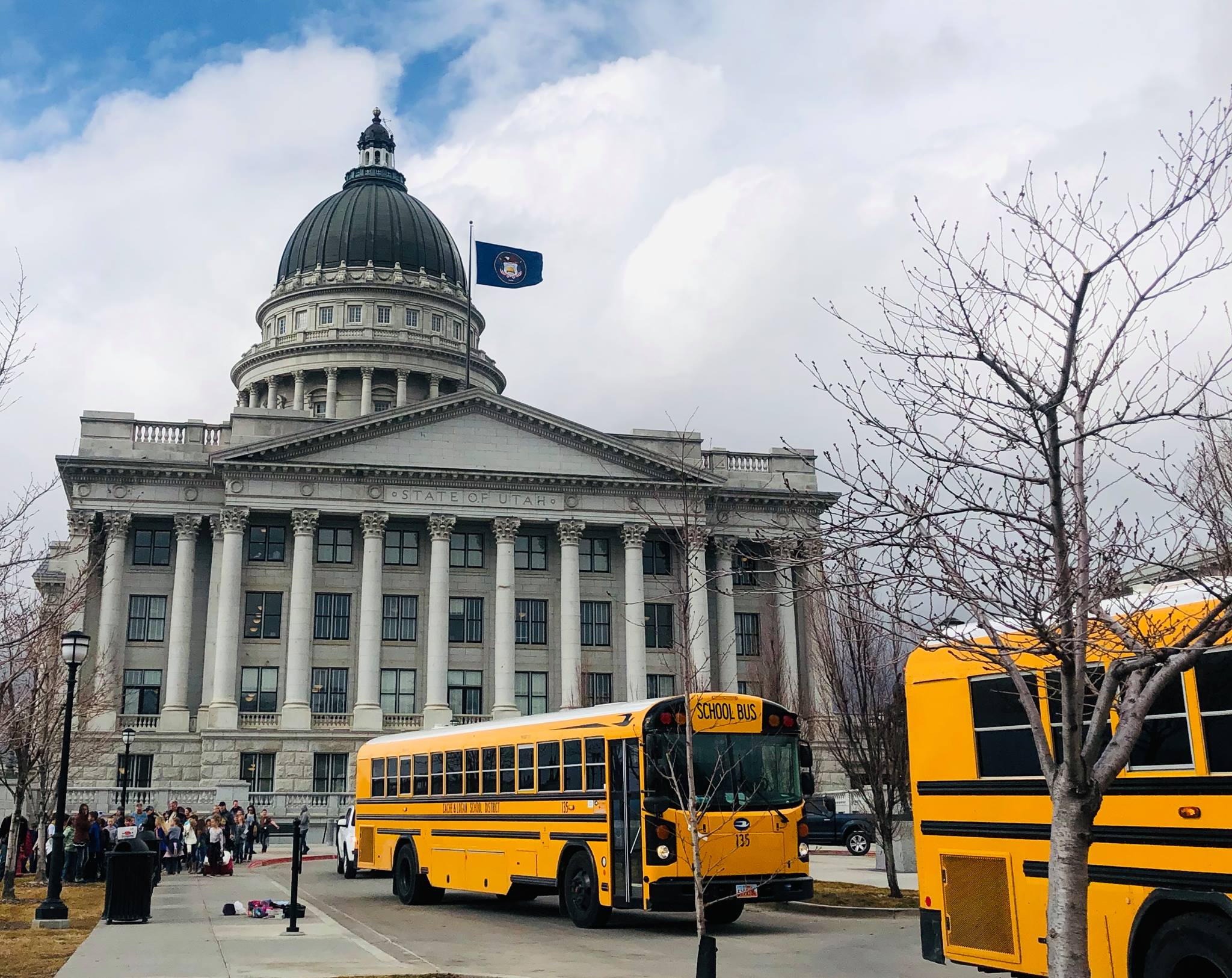 School buses lined up outside of the Utah State Capitol.