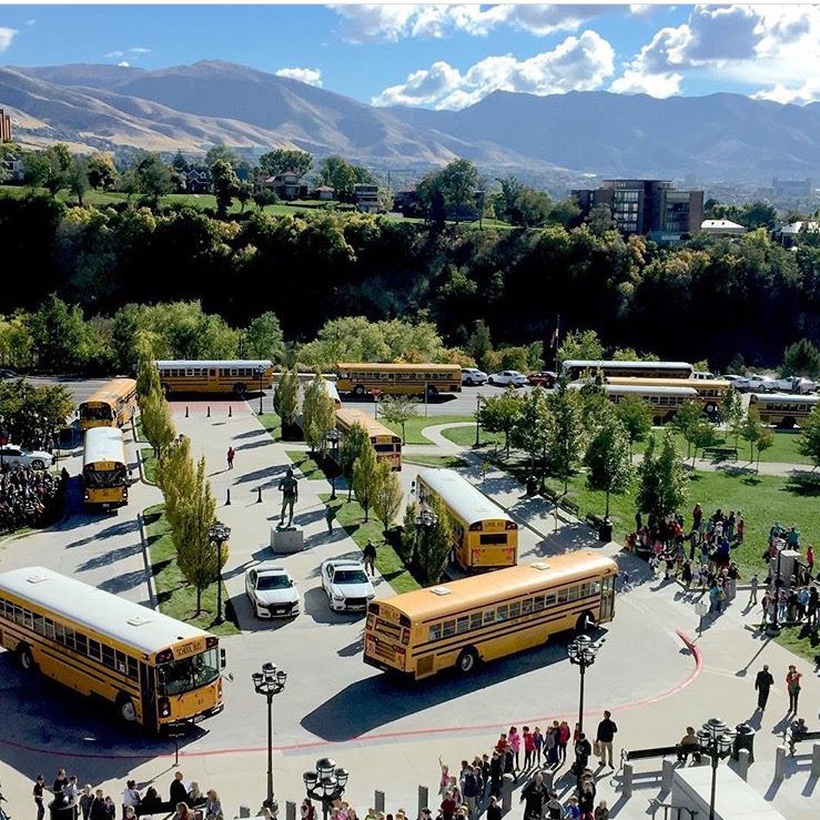 School buses lined up and groups of students gathered outside the Utah State Capitol.