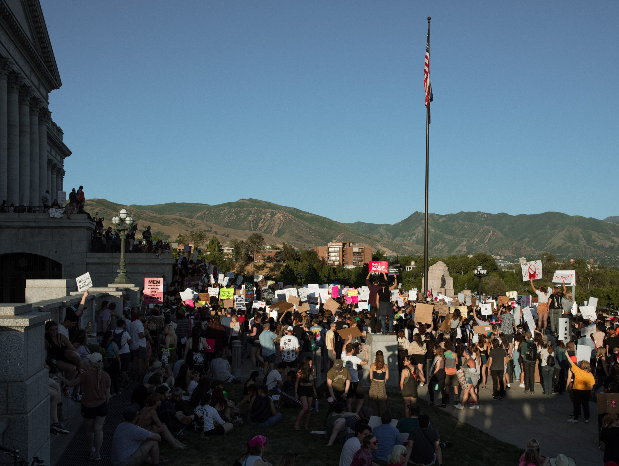 Crowd of rally attendants gathered at the south steps outside the Utah State Capitol.